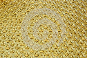 Golden buddha statue meditation on the wall in thai temple