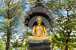 Golden Buddha statue on Patong Beach, Phuket, Thailand