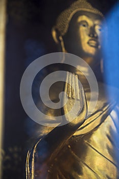Golden Buddha statue posing â€œThe attitude of forbidding the relatives to fightâ€.