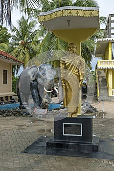 A golden Buddha statue stands at the Nagadipa Vihara on Nainativu Island in Sri Lanka.