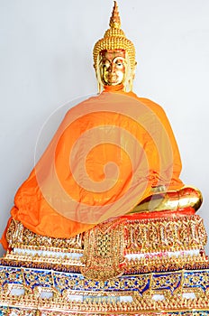 Golden Buddha Statue in Summer Dress
