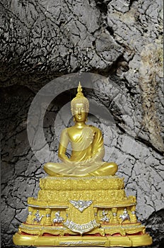 Golden buddha statue at Tham Pu Wa temple Kanchanaburi, Thail