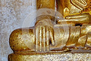 Golden Buddha statue at the Thatbyinnyu Temple in Bagan, Myanmar