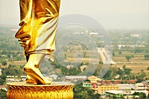 Golden Buddha statue of Wat Phra That Kao Noi Nan Thailand 