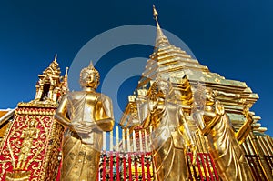 Golden Buddha statues and a golden pagoda or Chedi, Wat Phra That Doi Suthep, Chiang Mai, Thailand