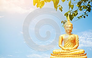 The golden Buddha statues on sky background