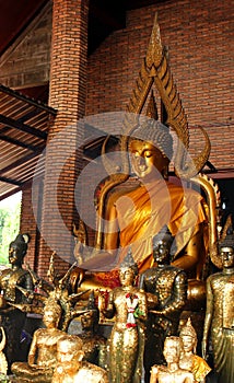 Golden buddha statues in a small temple at Wat Phra Sri Sanphet. Ayutthaya, Thailand.