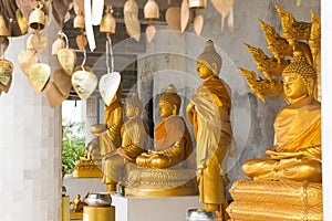 Golden Buddha statues in temple of Big white Buddha in Phuket