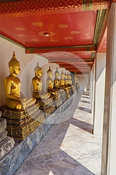 Golden buddha statues in Wat Pho Kaew, Bangkok, Thailand