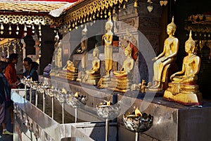 Golden Buddha statues in Wat Phra That Doi Suthep, Buddhist temple in Chiang Mai, Thailand.