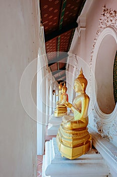 Golden buddhism monk statue in asian temple