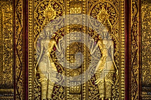 Golden Buddhist door sculpture