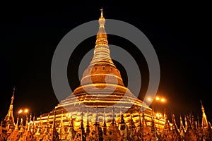 The golden buddhist pagoda or stupa of Shwedagon Pagoda at night time,Yangon, Myanmar