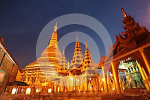 Golden buddhist pagoda or stupa of Shwedagon Pagoda at twilight, Yangon, Myanmar