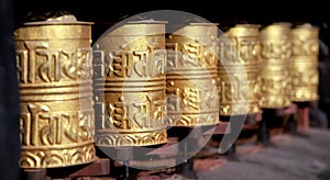 Golden buddhist prayer wheels