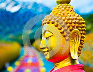 Golden Buddhist statues near Buddhist temple