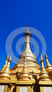 Golden buddhist stupa on the top of the Mount Popa Taung Kalat in Myanmar.