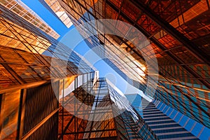 Golden building with blue sky. Windows glass of modern office sk