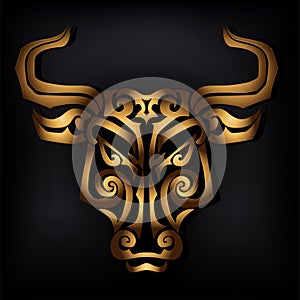 Golden bull head isolated on black background.