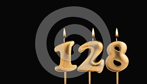 Golden candle 128 with flame - Birthday card on dark luxury background