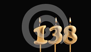 Golden candle 138 with flame - Birthday card on dark luxury background