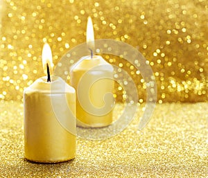 Golden candles. Gold glittering christmas lights.