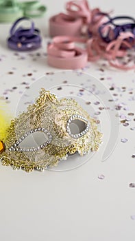 Golden carnival mask close-up on white background