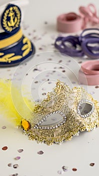 Golden carnival mask close-up on white background