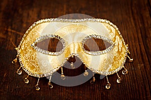 Golden carnival mask on the table