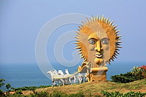 Golden carriage with white horses in the temple complex Murudeshwar, carrying to the sea with a huge sun