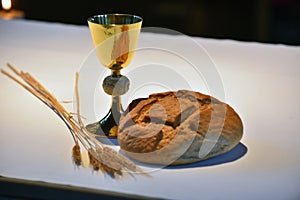 Golden chalice, bread.