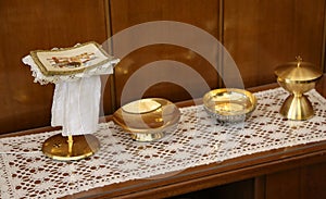 golden chalice and paten for Holy Communion during the Mass cere