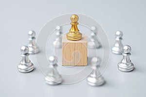 Golden chess pawn pieces or leader  businessman with circle of silver men. victory, leadership, business success, team, and