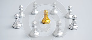 Golden chess pawn pieces or leader  leader businessman with circle of silver men. leadership, business, team, and teamwork concept