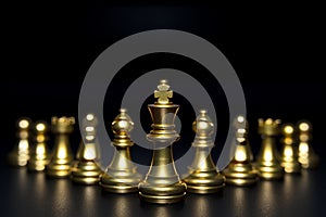 Golden chess pieces isolated on black background