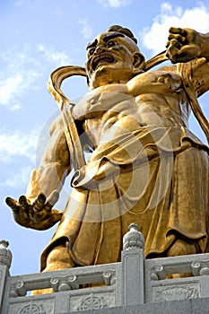 Golden Chinese deity statue