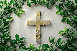 Golden christian cross with green leaves on white background. Happy Easter holiday