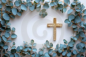 Golden christian cross with green leaves on white background. Happy Easter holiday