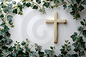Golden christian cross with green leaves on white background. Happy Easter holiday