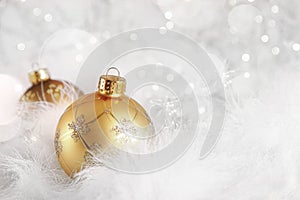 Golden Christmas balls on holiday background photo