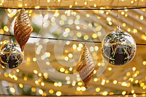 Golden Christmas balls, silve Christmas balls and small lights