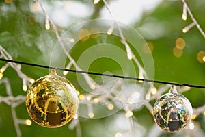 Golden Christmas balls, silve Christmas balls and small lights