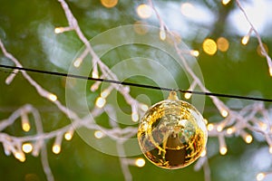 Golden Christmas balls, silve Christmas balls and small lights