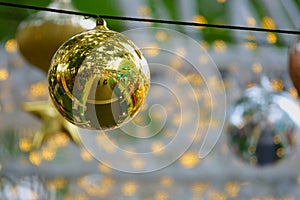Golden Christmas balls, silve Christmas balls and small lights
