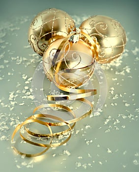 Golden christmas balls with snow decoration