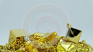 Golden Christmas decoration close up rotating on white background.