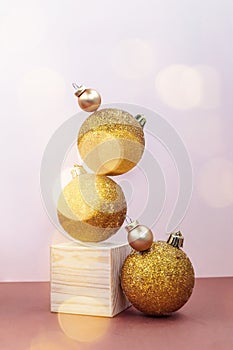 Golden Christmas decorations balancing still life, greeting card template