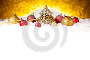 Golden christmas fir tree decoration with gold and red ornaments