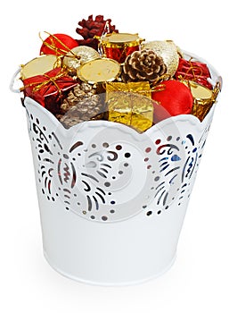 Golden Christmas gifts and dumps in decorative white bucket