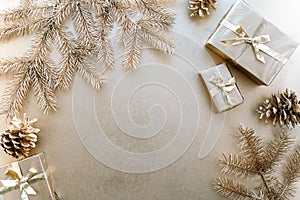 Golden Christmas or new year background,simple composition of Golden Christmas gifts,Golden fir branches and Golden pine cones,